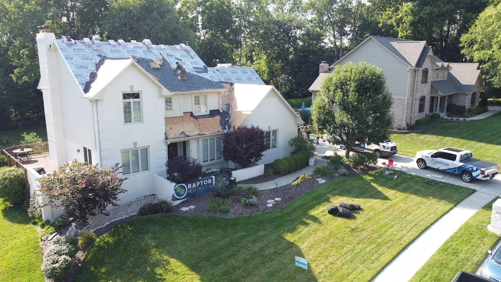 Raptor Roofing roof replacement project on a white home